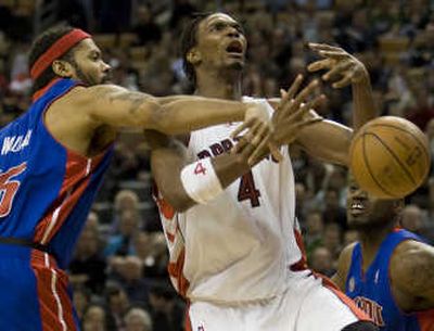Toronto's Chris Bosh, center, and the Raptors are the latest team to fall to the streaking Detroit Pistons. Associated Press
 (Associated Press / The Spokesman-Review)