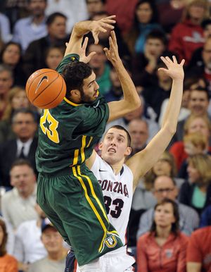 San Francisco Dons center Mark Tollefsen (23) loses control of the ball as Gonzaga Bulldogs forward Kyle Wiltjer (33) defends in the first half of a men's NCAA college basketball game, Thurs., Jan. 8, 2015, at the McCarthey Athletic Center in Spokane, Wash. (Colin Mulvany / The Spokesman-Review)
