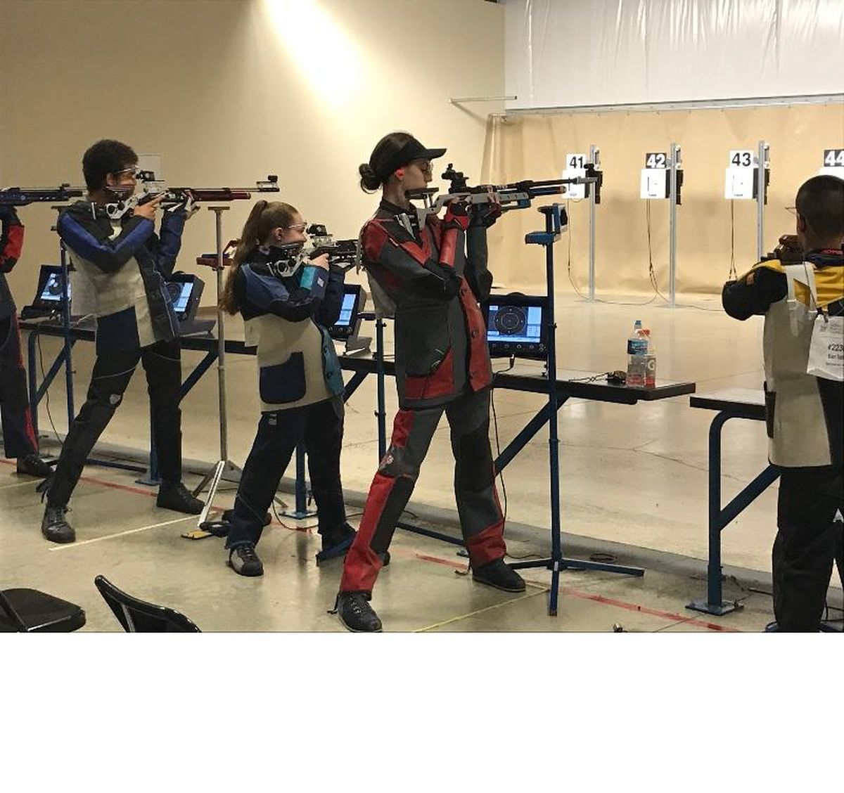 Spokane Junior Rifle Club Gold Team members – from left, David Wright, Cassidy Wilson, Taylor Christian and Ben Tafoya – compete last June at the Civilian Marksmanship Program National Air Rifle Championships and 3 Position Junior Olympic Air Rifle Championships at Camp Perry, Ohio. Competitors had to have prequalified at local matches. (Courtesy of Tammy Christian)