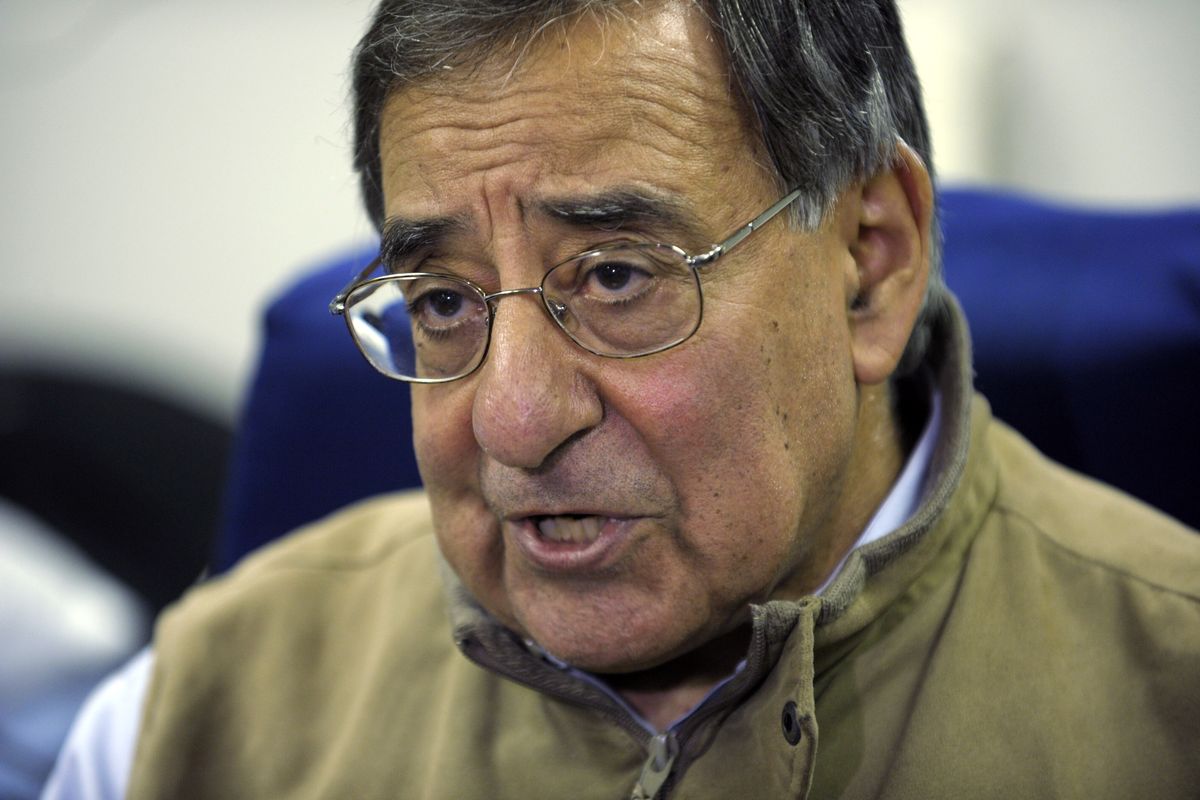 Defense Secretary Leon Panetta talks to reporters while on board his plane headed to Kuwait, Monday, Dec. 10, 2012. Panetta will meet with troops as part of a visit to thank the troops for their service. (Susan Walsh / Ap Pool)