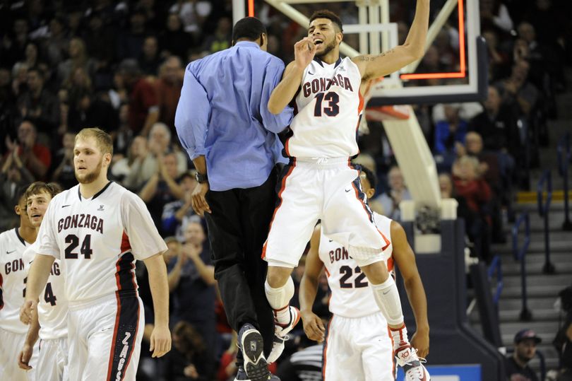Gonzaga’s Josh Perkins is sky-high after sinking a 3-pointer at the first-half buzzer to put the Bulldogs up 34 points. (Jesse Tinsley)