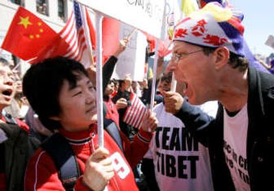 A Tibet supporter, right, argues with a China supporter at a rally for China's Olympic torch at the Ferry Plaza in San Francisco on Wednesday. Associated Press
(Associated Press / The Spokesman-Review)