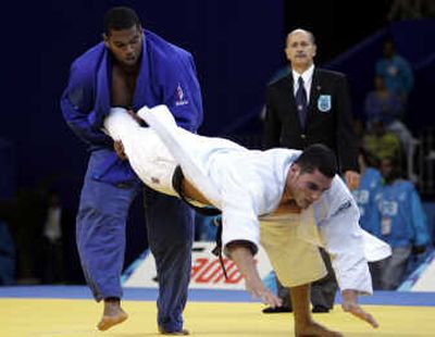 
Cuba's Oscar Brayson, left, fights Brazil's Joao Schlittler in the Judo Men's 100-plus kilogram competition. Brayson won the gold.Associated Press
 (Associated Press / The Spokesman-Review)