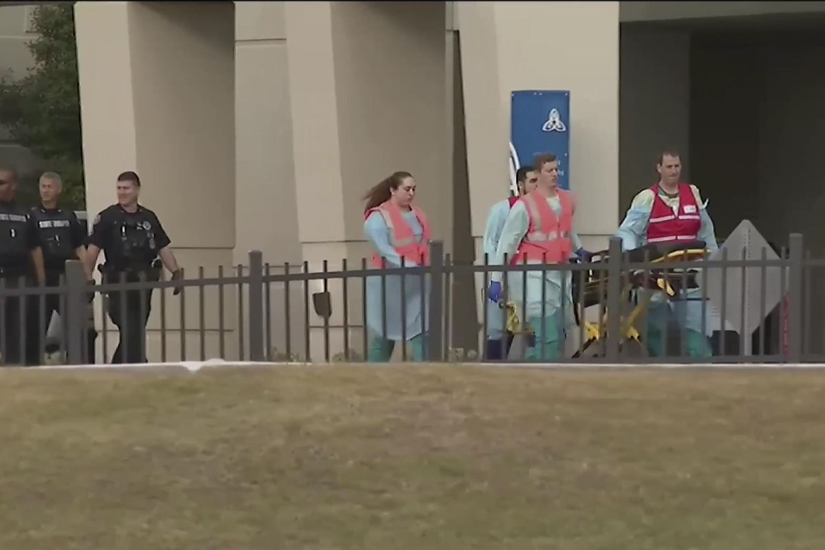 This photo taken from video provided by WEAR-TV shows emergency responders near the Naval Air Base Station in Pensacola, Fla., Friday, Dec. 6, 2019. The US Navy is confirming that there was a mass shooting at a Naval Air Station in Pensacola. Officials say four people, including the shooter, were killed. (AP)
