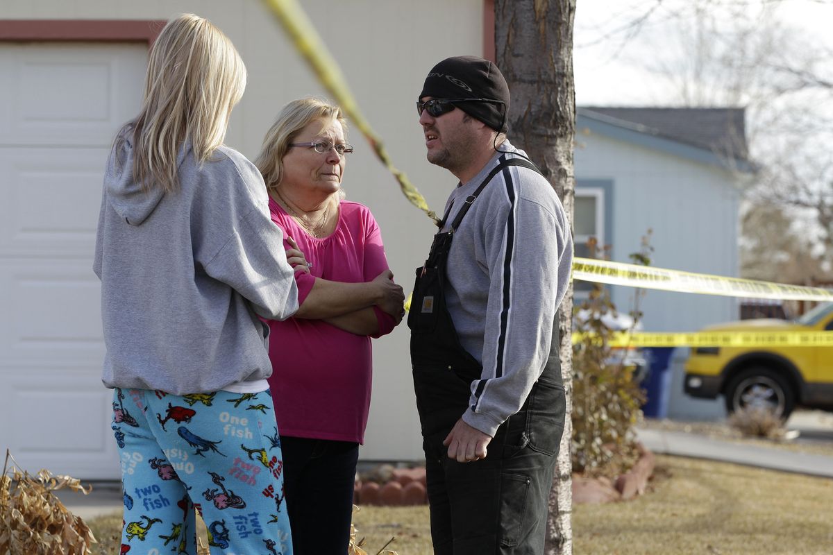 Neighborhood residents talk amid crime-scene tape at the scene of an apparent murder-suicide, which officials say left four dead inside a home, according to officials, in Longmont, Colo., Tuesday Dec. 18, 2012.  Weld County sheriff�s spokesman Tim Schwartz says dispatchers heard the woman who called 911 scream �No, no, no,� and then they heard a gunshot. Schwartz says a man grabbed the phone and said he was going to kill himself, and dispatchers heard another shot. (Brennan Linsley / Associated Press)