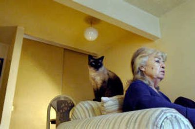 
Lisa Economon sits with her cat, Ling Singh, in her Coeur d'Alene apartment Monday. Economon receives in-home assistance with chores through the Area Agency on Aging of North Idaho.
 (Kathy Plonka / The Spokesman-Review)