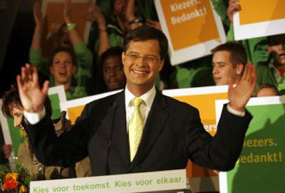 
Dutch Prime Minister Jan Peter Balkenende celebrates results of parliamentary elections  Wednesday in The Hague, Netherlands. 
 (Associated Press photos / The Spokesman-Review)