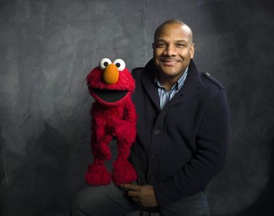 “Sesame Street” puppeteer Kevin Clash poses for a portrait with Elmo during the 2011 Sundance Film Festival to promote the film “Being Elmo” in Park City, Utah. (Associated Press)