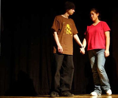 
Jacob Henthorn, left, as Jem leads Jordan Kern as Scout home after the confrontation at the jailhouse during a rehearsal of 