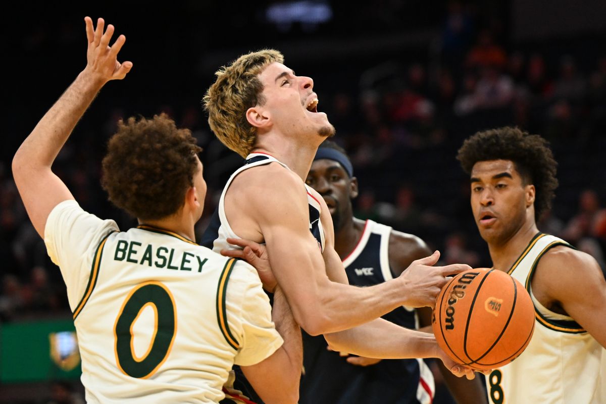 Gonzaga guard Mario Saint-Supery drives to the basket through contact from San Francisco guard Ryan Beasley during a West Coast Conference game on Wednesday at Chase Center in San Francisco.  (Tyler Tjomsland/The Spokesman-Review)