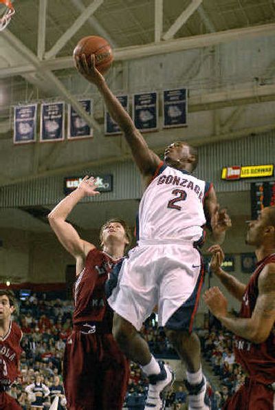 
Gonzaga's Jeremy Pargo soars for a basket in the first half of Saturday's 97-62 victory over Loyola Marymount.  The Zags will need another high-scoring game against Pepperdine tonight. The Waves are leading the WCC in scoring, averaging 81.9 points per game.
 (Dan Pelle / The Spokesman-Review)
