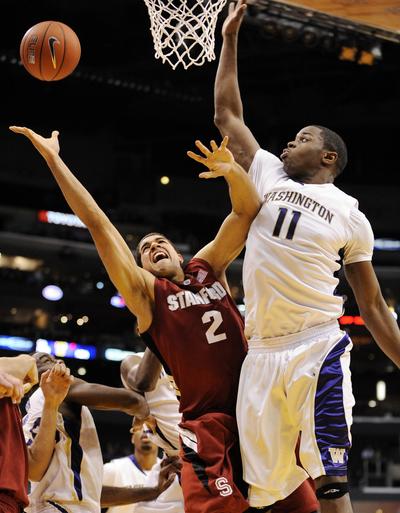 Stanford’s Landry Fields, left, puts up a shot as Washington’s Matthew Bryan-Amaning defends.  (Associated Press)
