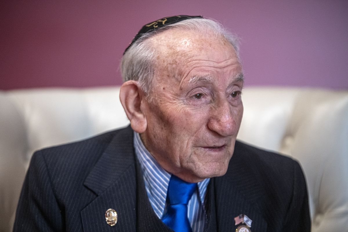 Joseph Alexander tells his story during an interview Monday at the Davenport Grand Hotel in Spokane. Alexander was a young teen living in Poland when he was imprisoned in a dozen Nazi concentration camps. At the age of 21, he was at Dachau when American soldiers liberated the concentration camp.  (Jesse Tinsley/THE SPOKESMAN-REVI)