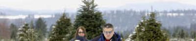 
Scott Carpenter leads his family, including his son Paul on sled, son Elijah, not seen sitting behind Paul, wife Jill holding daughter Rachel, through the rows of trees at Huckaba's Greenbluff Christmas Tree Farm.
 (Dan Pelle / The Spokesman-Review)