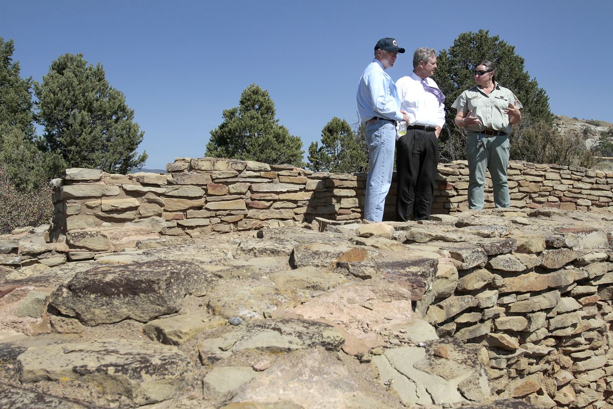 Wendy Sutton. archaeologist with the San Juan National Forest - Pagosa District explains the features of a kiva to Ken Salazar,  U.S. Department of the Interior secretary and Tom Vilsack, Secretary, U.S. Department of Agriculture as the two walk through the Ridge House ruins of the newly dedicated Chimney Rock National Monument Friday, Sept. 21, 2012 in Pagosa Springs, Colo. (Shaun Stanley / The Durango Herald)