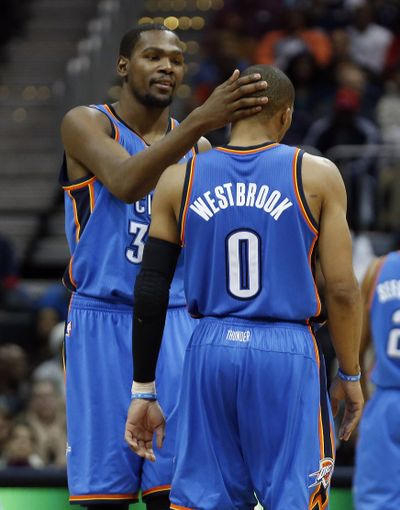 Russell Westbrook and Kevin Durant combined for 68 points in Thunder’s 100-92 win over Hawks. (Associated Press)
