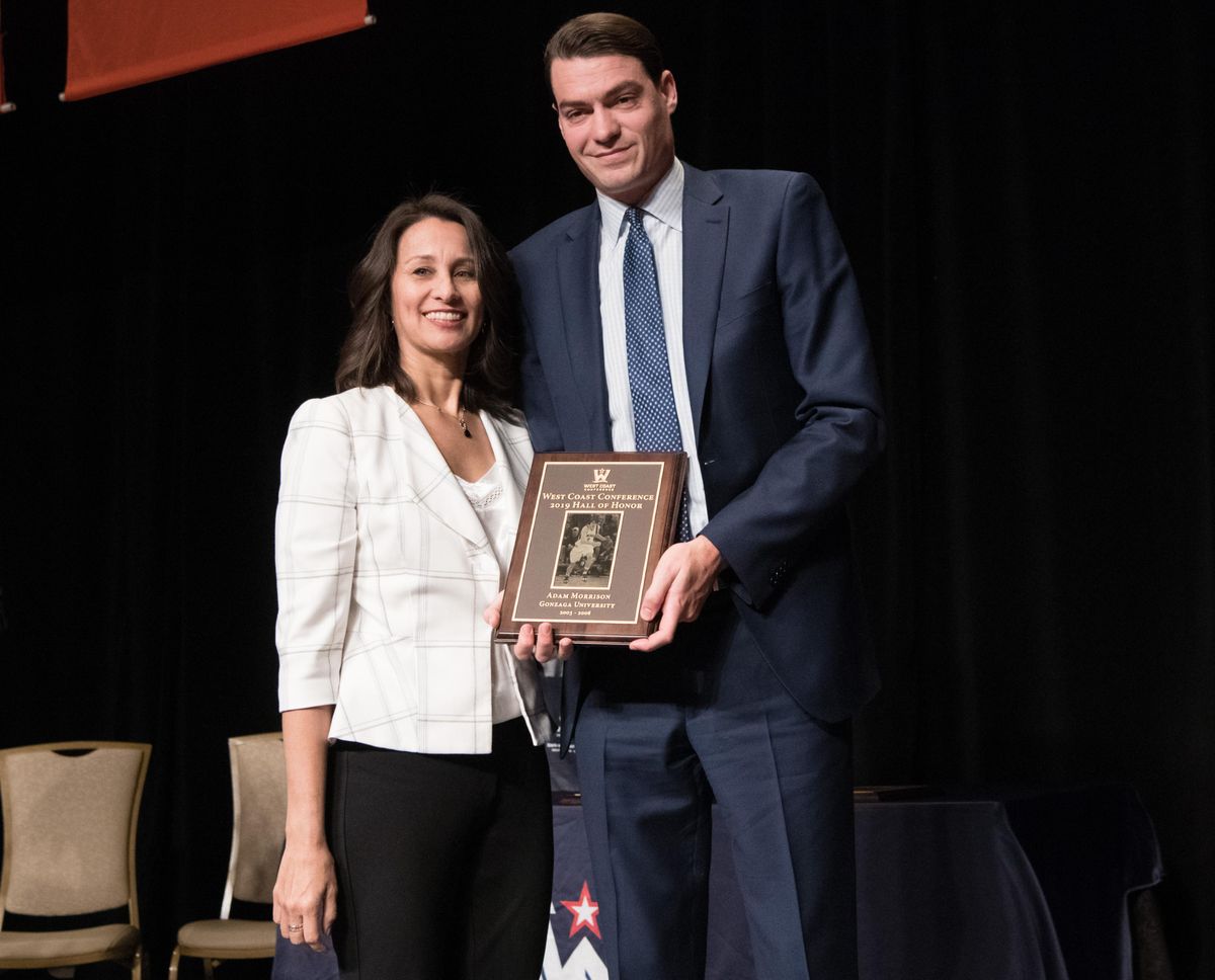 Adam Morrison poses for a photo with WCC Commissioner Gloria Nevarez during his induction into the WCC Hall of Honor on Saturday, March 9, 2019, at The Orleans Hotel & Casino in Las Vegas, Nev. (Tyler Tjomsland / The Spokesman-Review)