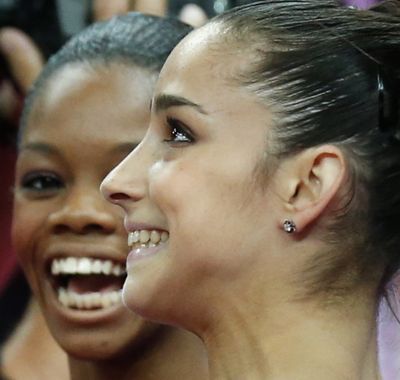 Alexandra Raisman, right, and Gabrielle Douglas vie for all-around medals today. (Associated Press)