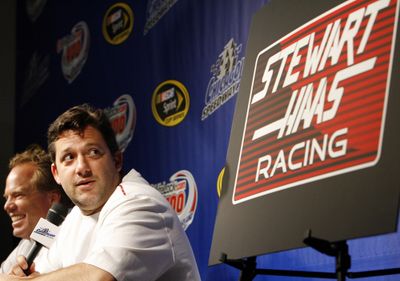 Tony Stewart, right, looks at the future of Haas-CNC Racing at a news conference with general manager Joe Custer. Associated Press (Associated Press / The Spokesman-Review)