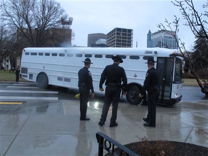A law enforcement bus transports 25 gay rights protesters to jail on Thursday, Feb. 20, 2014 in Boise, Idaho, after they were arrested at the Capitol on charges of misdemeanor trespassing. The protesters, who blocked public access to the Idaho Senate for hours, were among 32 people arrested over the course of the day as they demanded a hearing for a measure to add discrimination protections for gays and lesbians to the Idaho Human Rights Act.  (AP / John Miller)