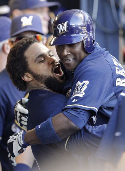 Prince Fielder, left, Yuniesky Betancourt both hit big home runs in Brewers’ Game 1 victory. (Associated Press)