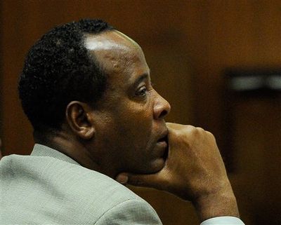 Dr. Conrad Murray listens on Nov. 3 as defense attorney Ed Chernoff, not pictured, gives the defense's closing arguments during the final stage of Murray's defense in his involuntary manslaughter trial in the death of singer Michael Jackson at the Los Angeles Superior Court in Los Angeles, Calif. A jury found Murray guilty on Monday. (File / Associated Press)