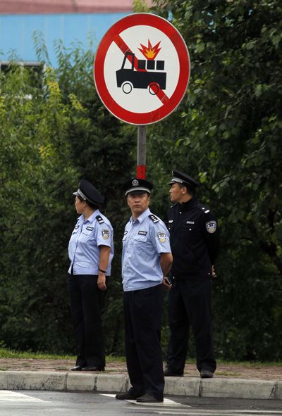 Chinese police guard an intersection before a convoy believed to be carrying North Korea’s Kim Jong Il passed today in Jilin, China.  (Associated Press)