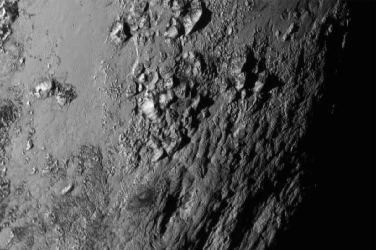 This image, captured by the New Horizons spacecraft and provided by NASA on Wednesday, shows a region near Pluto’s equator with a range of mountains. (Associated Press)