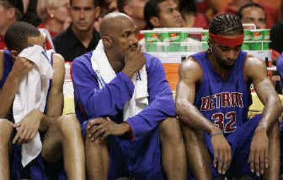 
Pistons, from left, Tayshaun Prince, Chauncey Billups and Richard Hamilton watch as end is near in Game 5. 
 (Associated Press / The Spokesman-Review)