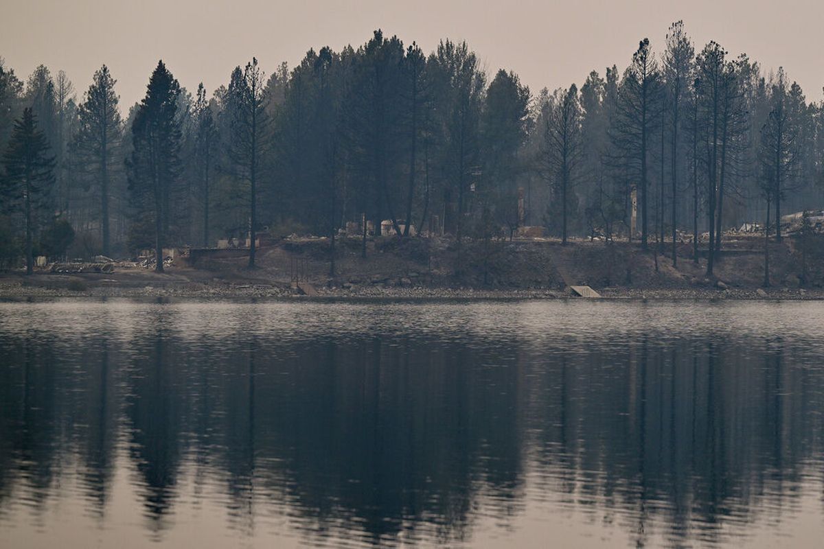Smoke clings to Silver Lake on Sunday, Aug. 20, 2023, after the Gray fire destroyed the structures on Friday on near Medical Lake.  (Tyler Tjomsland/The Spokesman-Review)