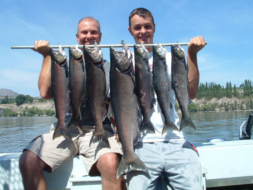 Randy and Chase Plischke of Spokane with their mixed bag of Chinook and Sockeye after fishing the Upper Columbia River Brewster Pool. (Anton Jones)