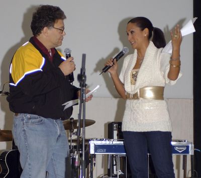 In this image provided by the U.S. Army, then-comedian Al Franken and sports commentator Leeann Tweeden perform a comic skit at Forward Operating Base Marez in Mosul, Iraq, on Dec. 16, 2006, during the USO Sergeant Major of the Army's 2006 Hope and Freedom Tour. (Creighton Holub / Associated Press)
