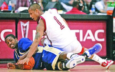 
Washington's Justin Dentmon, left, and Washington State's Mac Hopson battle for a loose ball. WSU beat UW to advance to the semifinals at the Pac-10 tournament. 
 (Associated Press / The Spokesman-Review)