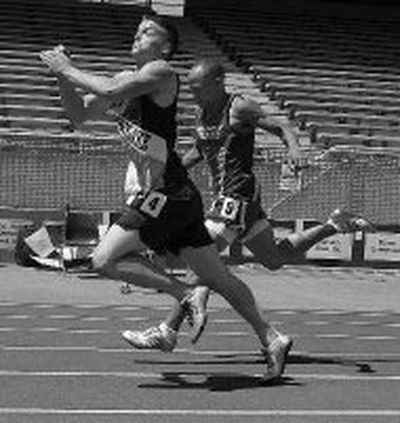 
Timberlake junior Nick Puckett pushes past Filer's Casey Dabney to win the 200-meter title at Saturday's State 3A meet. 
 (Steve Conner Special to / The Spokesman-Review)