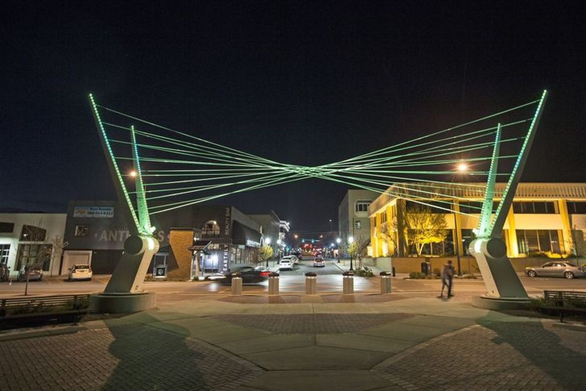 The "Under the Rainbow" sculpture at the entrance of McEuen Park at Fourth Street as seen at night after crews worked to update the structure earlier in the day on Friday. (Loren Benoit/Coeur d'Alene Press photo)