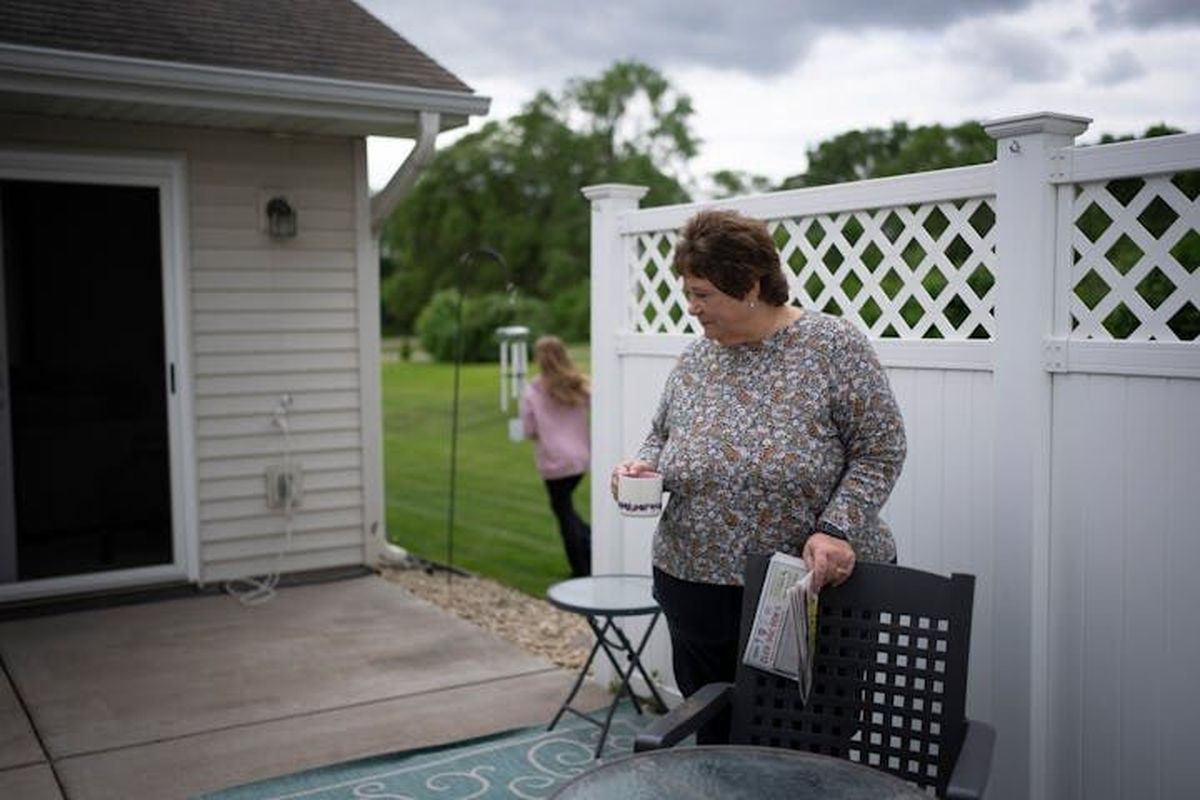 Deb Jerikovsky spends time on the patio of her new home in Coon Rapids, Minn., on June 6.  (Renée Jones Schneider/Minneapolis Star Tribune/TNS)