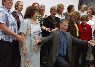 
Dr. Tim Quinn is surrounded by Hospice staff members before a picture is taken at a reception to honor him for serving for 23 years as volunteer medical director of Hospice of North Idaho.
 (Kathryn Stevens  Spokesman-Review / The Spokesman-Review)
