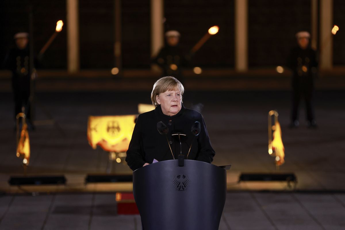 German Chancellor Angela Merkel makes a speech at the Defence Ministry during the Grand Tattoo (Grosser Zapfenstreich), a ceremonial send-off for her, in Berlin on Thursday, Dec. 2, 2021.  (Odd Andersen)