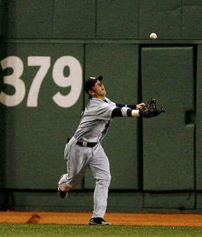 
M's center fielder Jeremy Reed plays ball off wall on two-run double by Alex Gonzalez in fourth.
 (Associated Press / The Spokesman-Review)
