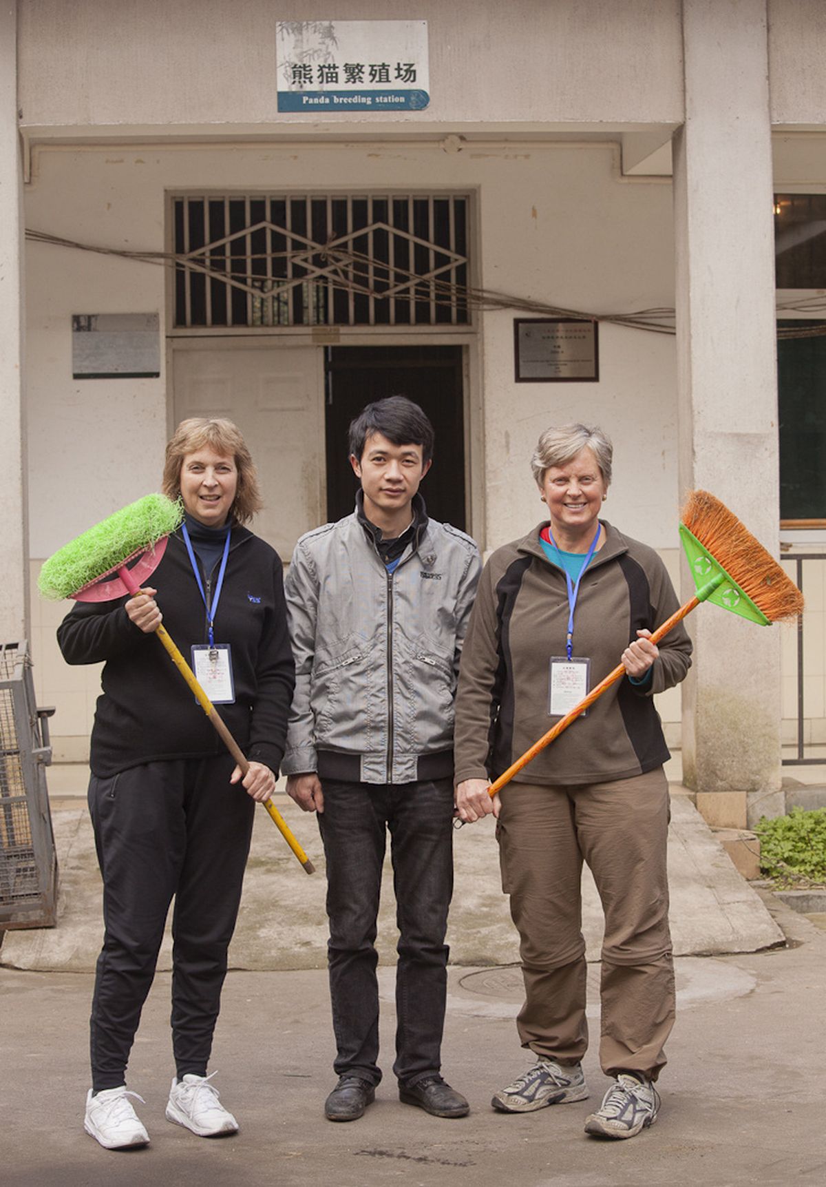 Susan Snelson Spiegel, left, poses with the panda keeper and her sister, Chris Thompson, at a panda reserve outside Chengdu, China.