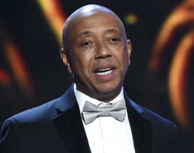 Hip-hop mogul Russell Simmons presents the Vanguard Award on stage at the 46th NAACP Image Awards on Feb. 6, 2015, in Pasadena, Calif. (Chris Pizzello / Associated Press)