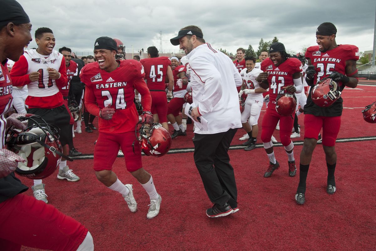 EWU coach Beau Baldwin performs a little dance after the Red-White game, much to amusement of his players. (DAN PELLE danp@spokesman.com)