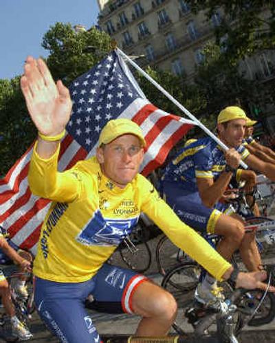 
Six-time Tour de France winner Lance Armstrong, of Austin, Texas, foreground, wears a 