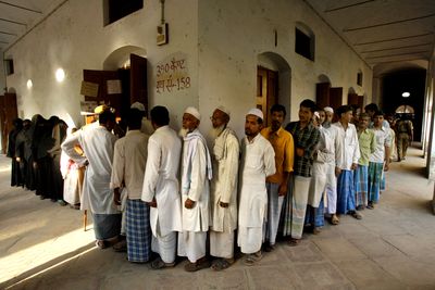 People stand in line to cast their votes at a polling station in Varanasi, India, on Thursday during the first phase of India’s general elections – a monthlong process.  (Associated Press / The Spokesman-Review)