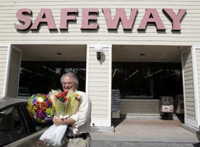 
A customer buys flowers at a Safeway store in Mountain View, Calif. The chain's profit fell 11 percent in the second quarter. Associated Press
 (Associated Press / The Spokesman-Review)