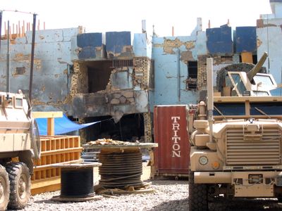 Military vehicles are seen Friday at a U.S.-Iraqi military outpost in the Sadr City section of Baghdad that was struck April 28 by an improvised rocket-assisted mortar.  (Associated Press / The Spokesman-Review)
