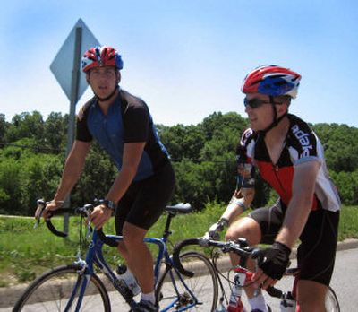 
How does this compare to boot camp? Army Sgt. Drew Biddle and Staff Sgt. Yegor Bonderenko, both wounded in service, cycle through the Ozark Mountains during the Soldier Ride fundraiser. 
 (Associated Press / The Spokesman-Review)