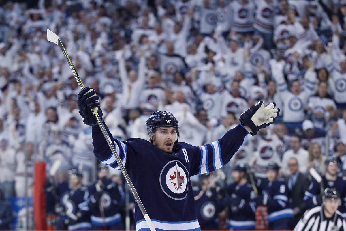 Winnipeg Jets’ Mark Scheifele (55) celebrates his goal against the Minnesota Wild during the second period of Game 1 in an NHL hockey first-round playoff series Wednesday, April 11, 2018, in Winnipeg, Manitoba. (John Woods / Canadian Press via AP)