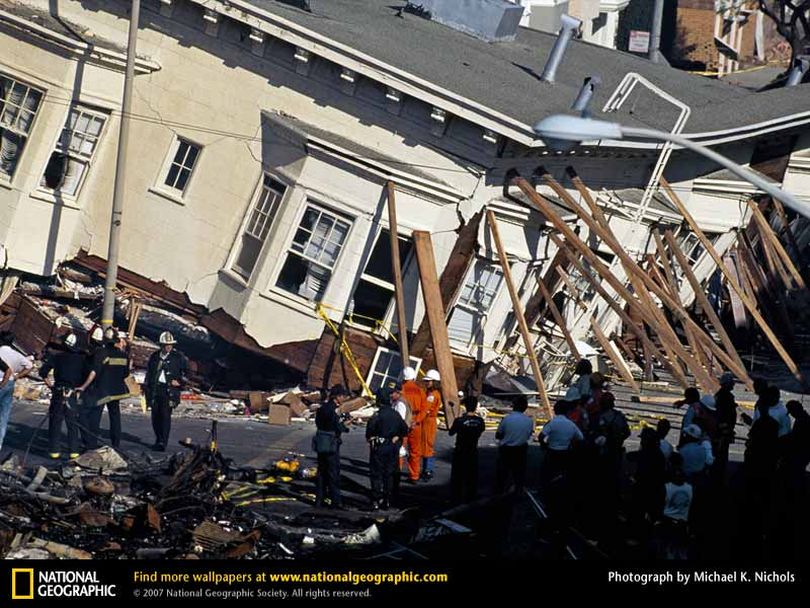 Workers position support beams to steady tilting homes in San Francisco's Marina District after a disastrous earthquake hit the city in 1989. The 7.1-magnitude earthquake buckled highways and bridges, crushed cars, and toppled homes and buildings throughout the city.
Photograph by Michael K. Nichols
Photo: National Geographic  (The Spokesman-Review)