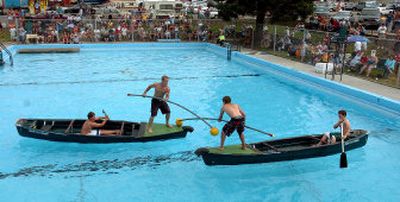 
Jousters Travis Christensen, 12, second from left, and Nick Caswell, second from right, square off in the St. Maries municipal pool during the water events at Paul Bunyan Days on Saturday. Derek Tweedy, left, and Scott Carr, right, are paddling. 
 (Jesse Tinsley / The Spokesman-Review)